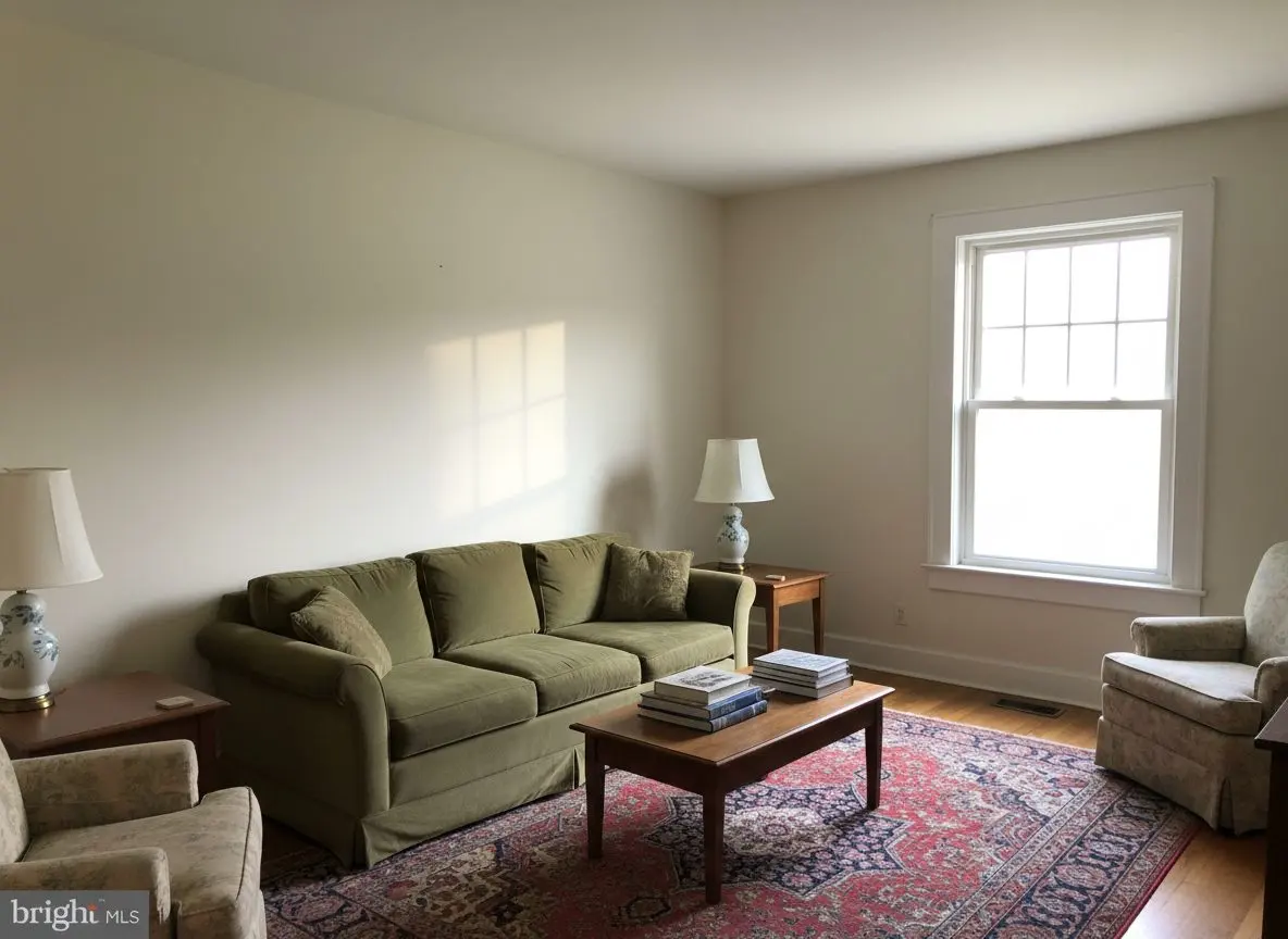 A furnished sitting room in an older brick house, finished and lived in